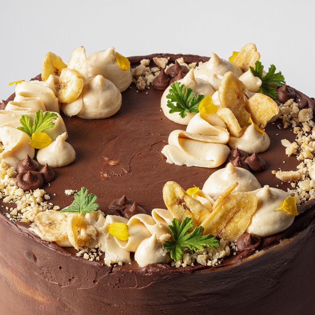 Chocolate Cake with Salted Tahini, Glazed Bananas, Salted Caramel & Dark Chocolate Ganache