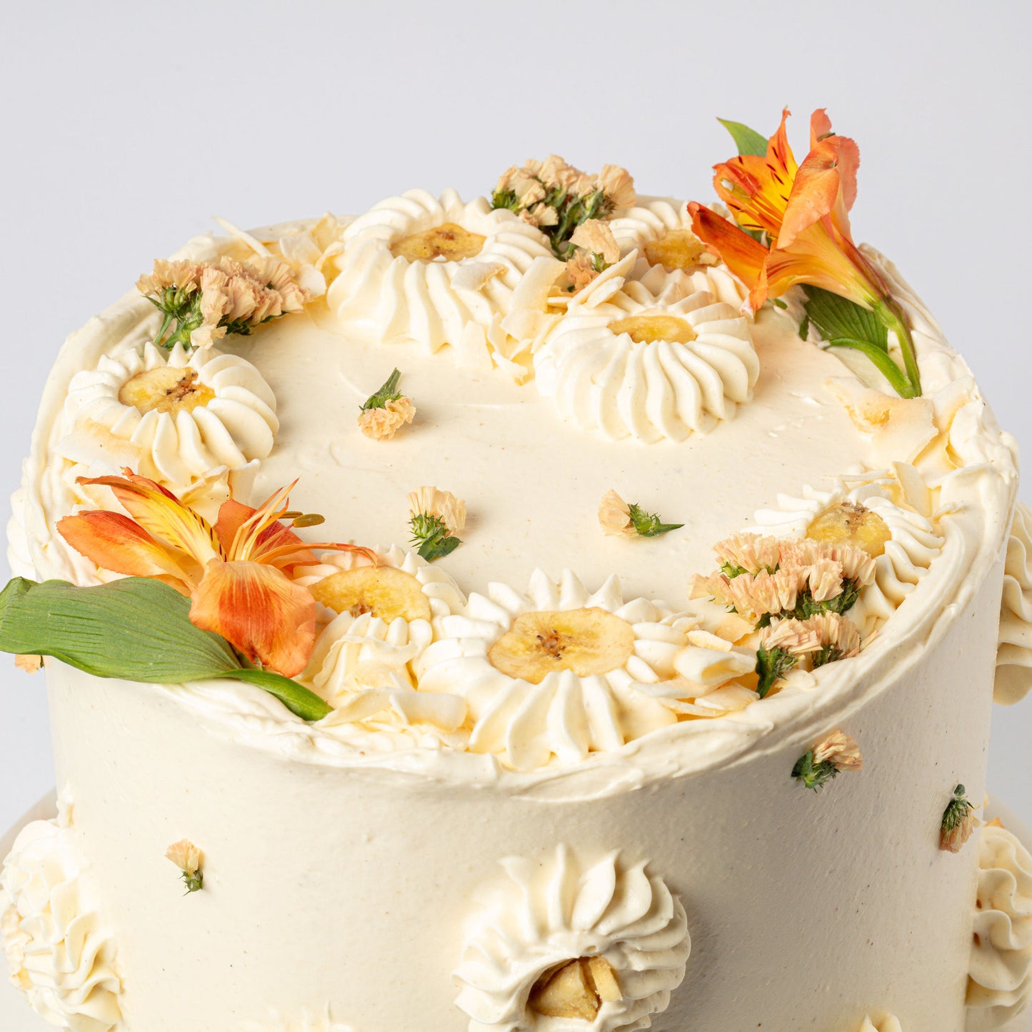 Vanilla-Mylk Chiffon Cake with Fresh Coconut, Glazed Bananas & Cream & Coconut Buttercream