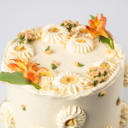 Vanilla-Mylk Chiffon Cake with Fresh Coconut, Glazed Bananas & Cream & Coconut Buttercream